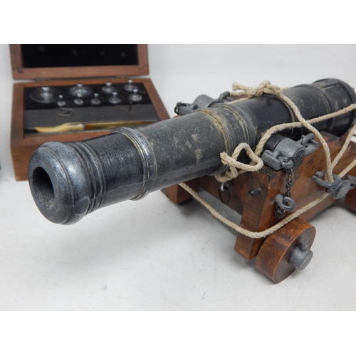 388 - A Large Desk Cannon together with a set of Jewellers Weights in fitted wooden case & a musical balle... 