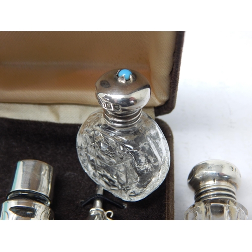 144 - Victorian Silver Topped Perfume Bottle together with a further silver perfume topped bottle with ins... 