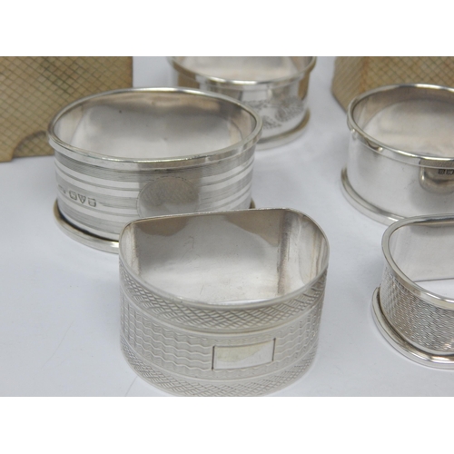 146 - A Quantity of Hallmarked Silver Napkin Rings, All with blank cartouches: Various Dates & Makers (7)