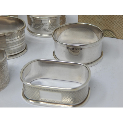 146 - A Quantity of Hallmarked Silver Napkin Rings, All with blank cartouches: Various Dates & Makers (7)