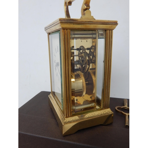 351 - Garrard & Co, Crown Jewellers, Brass Carriage Clock with fluted column decoration, complete with key... 