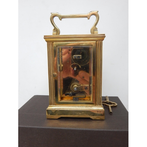 351 - Garrard & Co, Crown Jewellers, Brass Carriage Clock with fluted column decoration, complete with key... 