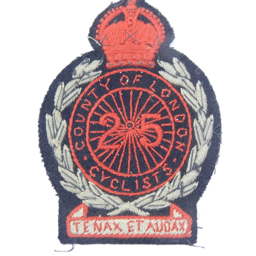 357 - WWI Cyclists Battalion Badges together with a Blazer Badge