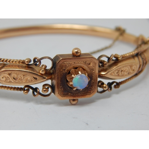 256 - Victorian Continental Gold Hinged Bangle Set with an Opal Cabochon: Weight 8.33g