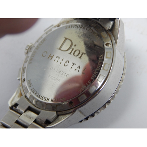 306 - Dior: A Christian Dior Christal diamond set bracelet watch, the black chronograph dial set with 14 r... 