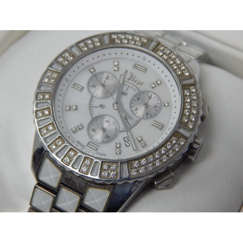 307 - Dior: A Christian Dior Christal diamond set bracelet watch, the white chronograph dial set with 14 r... 