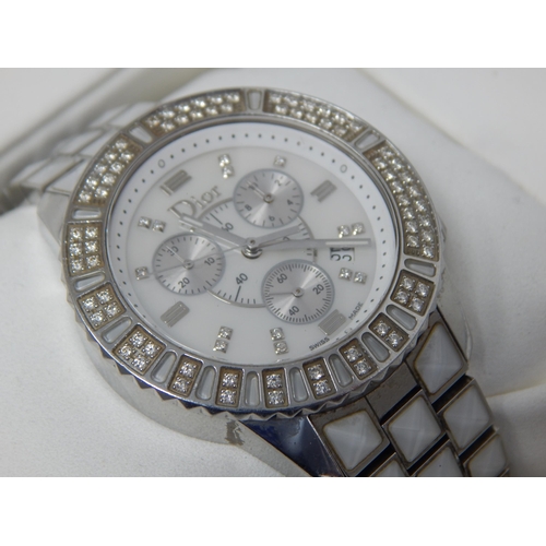 307 - Dior: A Christian Dior Christal diamond set bracelet watch, the white chronograph dial set with 14 r... 