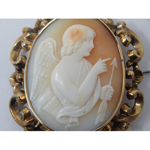 212 - Well carved 19th Century unmarked yellow metal cameo brooch depicting Cupid. 5.5cm x 4.5cm