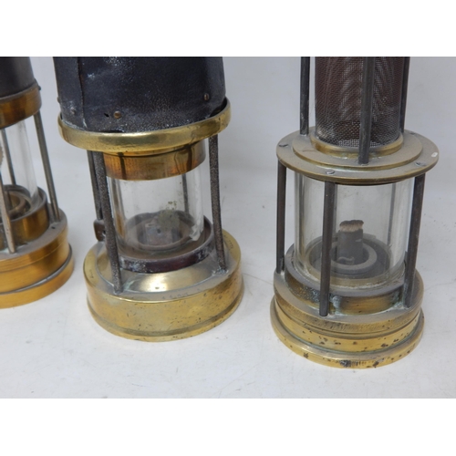 309 - A Group of Unmarked Miners Lamps: Tallest 27cm