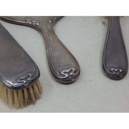 105 - An Edwardian Silver Three Piece Dressing Table Set Comprising Mirror & Brushes: Hallmarked Birmingha... 