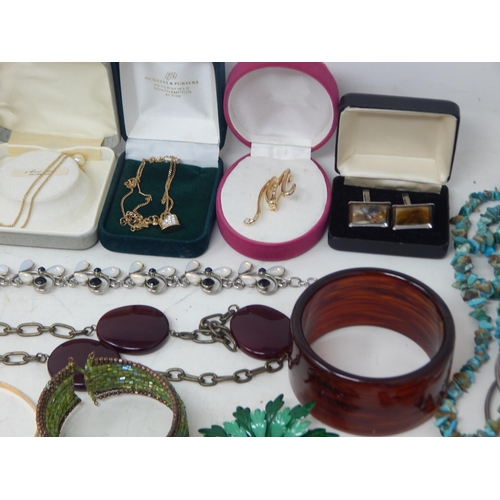 229 - A Huge Quantity of Vintage Costume Jewellery Including Brooches, Beaded Necklaces, Bangles etc (lot)