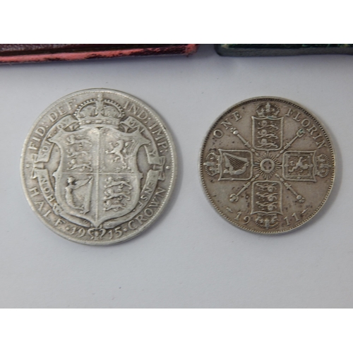 84 - 1915 Silver Half Crown, 1911 Florin, 1951 Festival of Britain Crowns in cases of issue (2) commemora... 