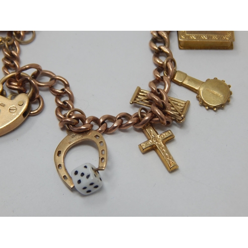 237 - 9ct Gold Charm Bracelet with Numerous Charms: Gross weight 27.49g