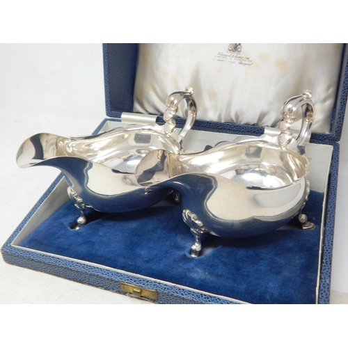 146 - A Pair of Silver Gravy Boats Hallmarked London 1928 by Goldsmiths & Silversmiths Ltd. Presented in o... 