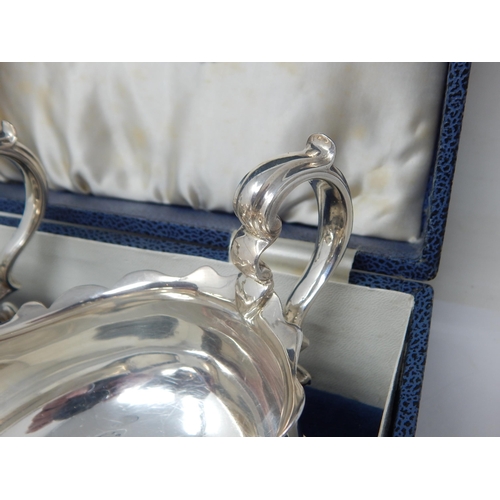 146 - A Pair of Silver Gravy Boats Hallmarked London 1928 by Goldsmiths & Silversmiths Ltd. Presented in o... 