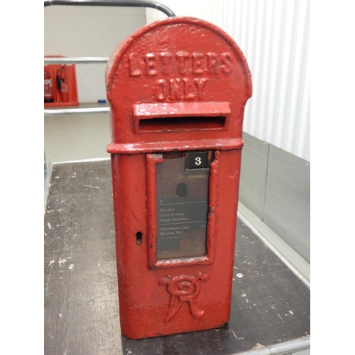 A Victorian red painted cast iron wall mounted post box with key, 72cm tall