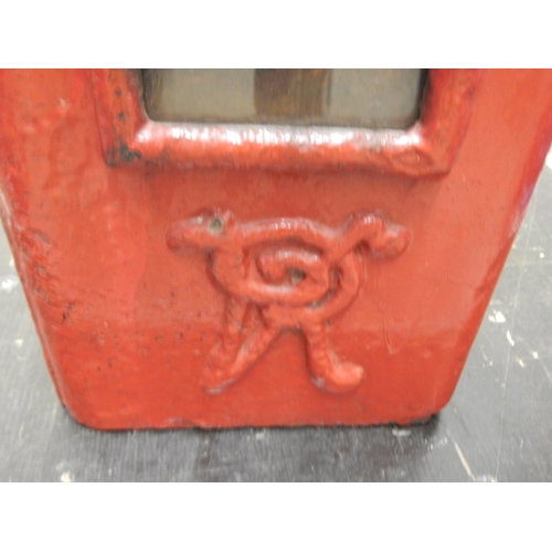 324 - A Victorian red painted cast iron wall mounted post box with key, 72cm tall