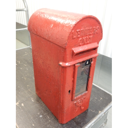 324 - A Victorian red painted cast iron wall mounted post box with key, 72cm tall