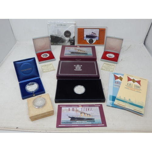 77 - R.M.S Titanic: 5 x Silver Commemorative Medals together with a Royal Mint Centenary £5 Coin in Pack ... 