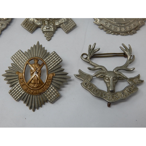 87 - A Collection of Military Badges to Include: The Queen Own Cameron, Argyle & Sutherland, The Royal Hi... 