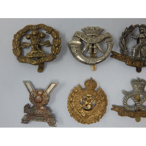 88 - A Collection of Military Badges to Include: South Lancashire Regiment, Cornwall, Royal Warwickshire ... 