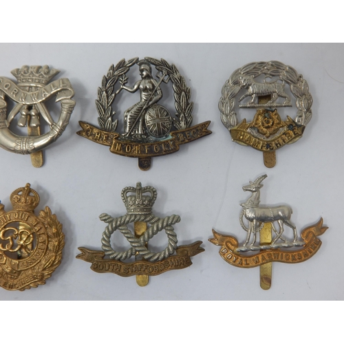88 - A Collection of Military Badges to Include: South Lancashire Regiment, Cornwall, Royal Warwickshire ... 