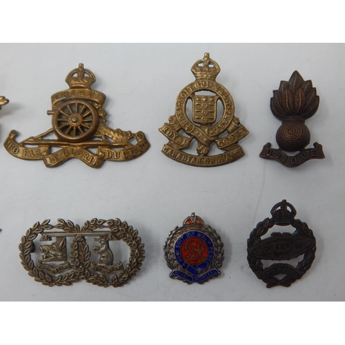 100 - A Collection of Military Badges to Include: WWI Tank Badge, Royal Artillery (2), Royal Canadian Ordn... 