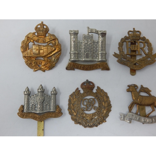 95 - A Collection of Military Badges to Include: Tank Corps, Inniskilling, Royal Defence Corps, Royal Mil... 