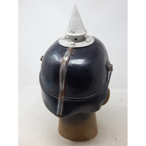 202 - A WWI Imperial German Army pickelhaube uniform helmet. Leather construction with brass front plate d... 