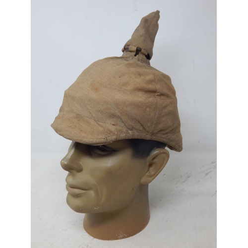 204 - A WWI Imperial German Army pickelhaube uniform helmet with cover. Leather construction with brass fr... 