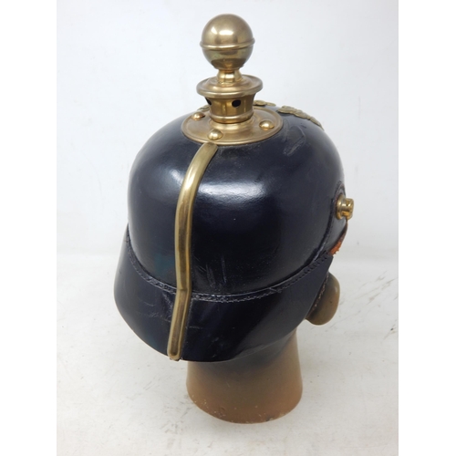 205 - A WWI Imperial German Army pickelhaube uniform helmet. Leather construction with brass front plate d... 