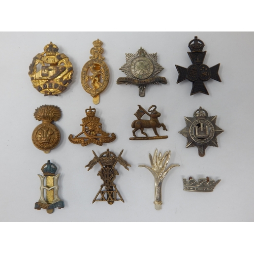 135 - Military Cap Badges Including Tank Corps, Royal Welsh Fusiliers, Hussars etc