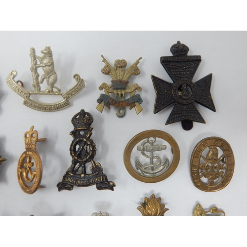 141 - Quantity of Military Cap Badges Including Warwickshire & 3rd Carabiners