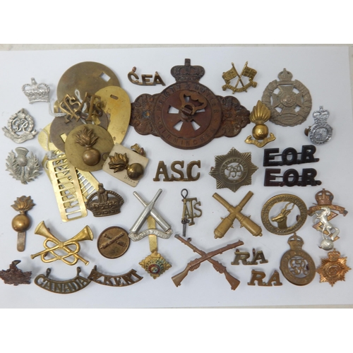 143 - Quantity of Military Cap Badges, Shoulder Badges & Collar Badges