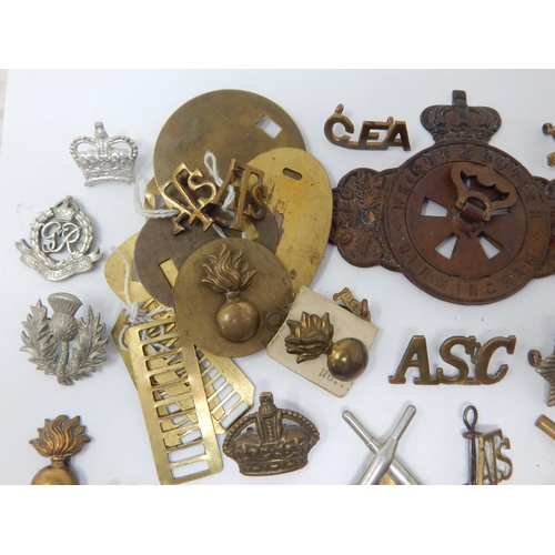 143 - Quantity of Military Cap Badges, Shoulder Badges & Collar Badges