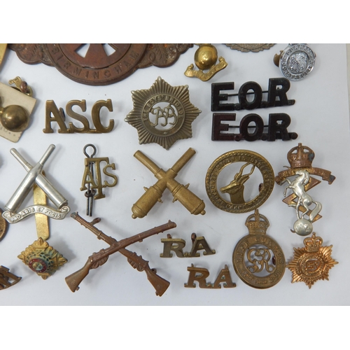 143 - Quantity of Military Cap Badges, Shoulder Badges & Collar Badges