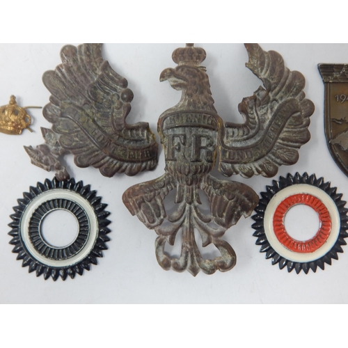 165 - WWI German Pickelhaube Helmet Plate (damaged) together with a WWII German Badge etc