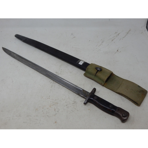 176 - WWI Wilkinson Bayonet with Scabbard. Length 58cm overall