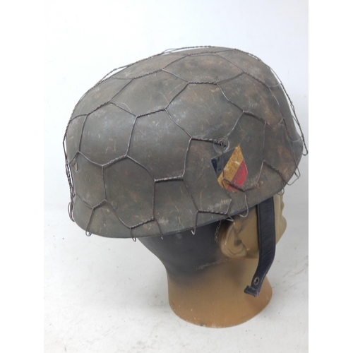 219 - A WWII German Paratroopers Helmet. Note: Customers must satisfy themselves prior to bidding in regar... 