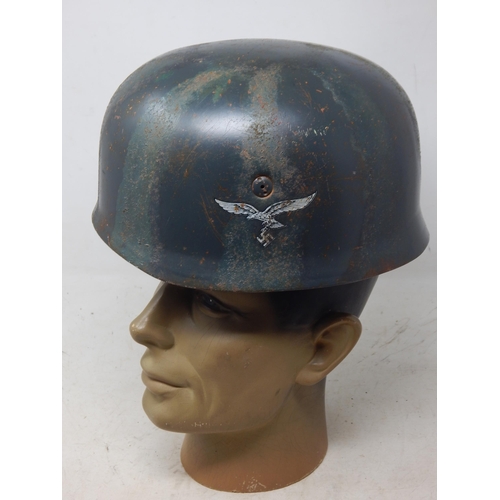 221 - A WWII German Paratroopers Helmet. Note: Customers must satisfy themselves prior to bidding in regar... 