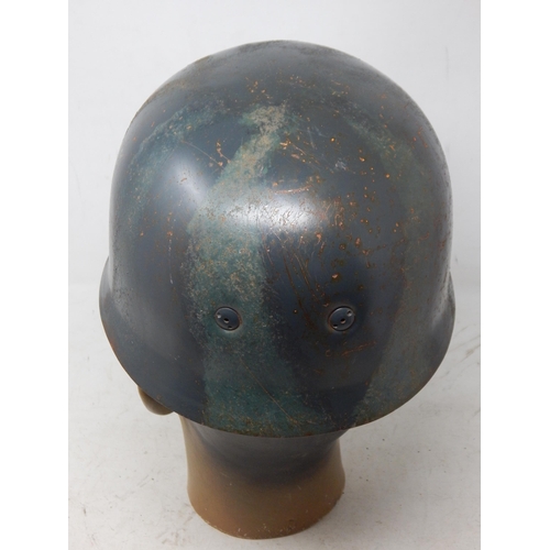 221 - A WWII German Paratroopers Helmet. Note: Customers must satisfy themselves prior to bidding in regar... 