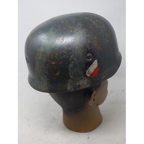 221 - A WWII German Paratroopers Helmet. Note: Customers must satisfy themselves prior to bidding in regar... 