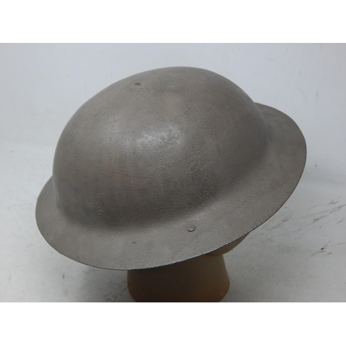 224 - WWI British Brodie Helmet with Raw Edge & Chin Strap. Note: Customers must satisfy themselves prior ... 