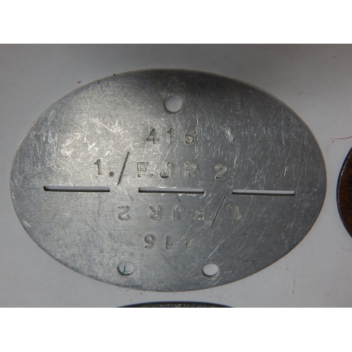 385 - WWII German Erkennungsmarke (Identification Tag): this was the standard-issue German military identi... 