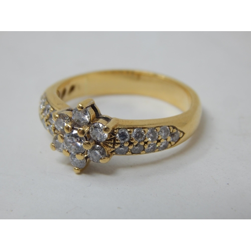 22 - 15ct gold ring set with 25 diamonds estimated @ 1.5cts, gross weight 5.69g