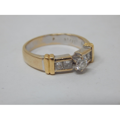 23 - 18ct gold ring set with a central brilliant cut diamond & bordered with four princess cut diamonds, ... 