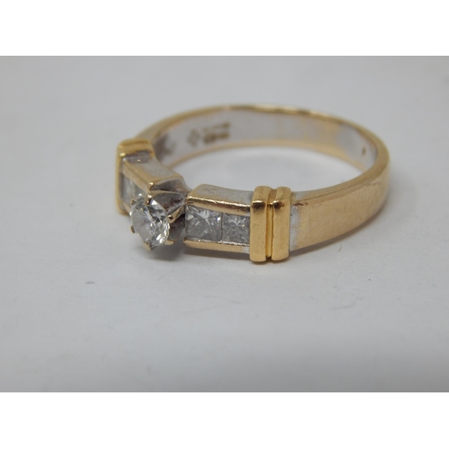 23 - 18ct gold ring set with a central brilliant cut diamond & bordered with four princess cut diamonds, ... 