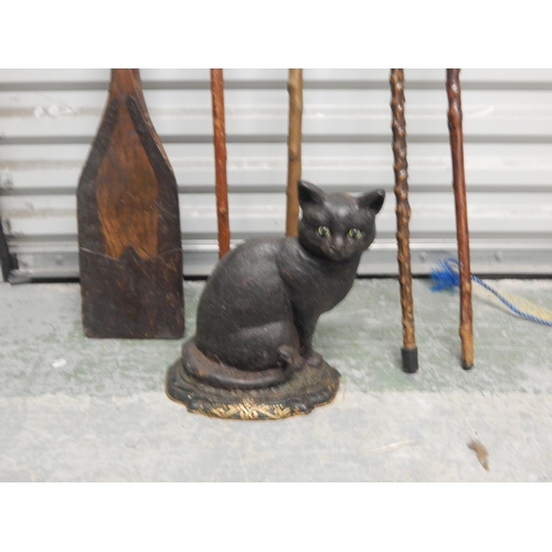 471 - 4 x Walking Sticks, Wooden oar & a Cast Iron Door Stop