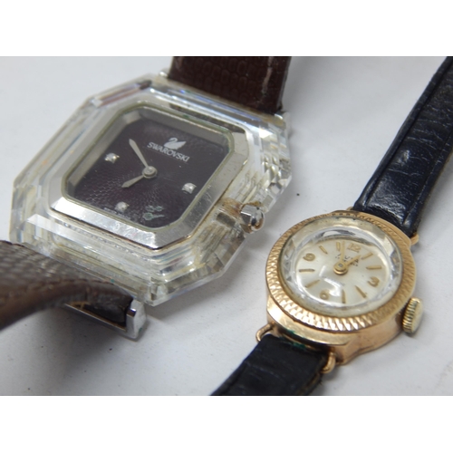 35 - Ladies 9ct Gold wristwatch twinned with a Swarovski ladies wristwatch