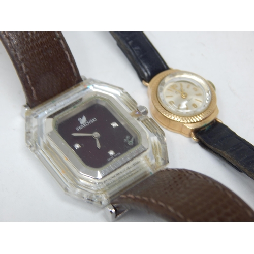 35 - Ladies 9ct Gold wristwatch twinned with a Swarovski ladies wristwatch